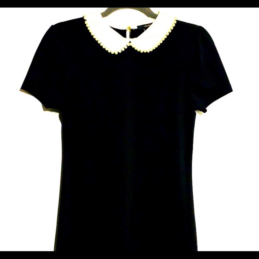 Black dress white collar. Perfect Halloween costume for Wednesday Adams.